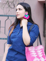 Nida Shine Earrings, a handcrafted unique coin earring with handmade ikat base and mirror and tassel detailing from our bohemian collection of earrings for women online.