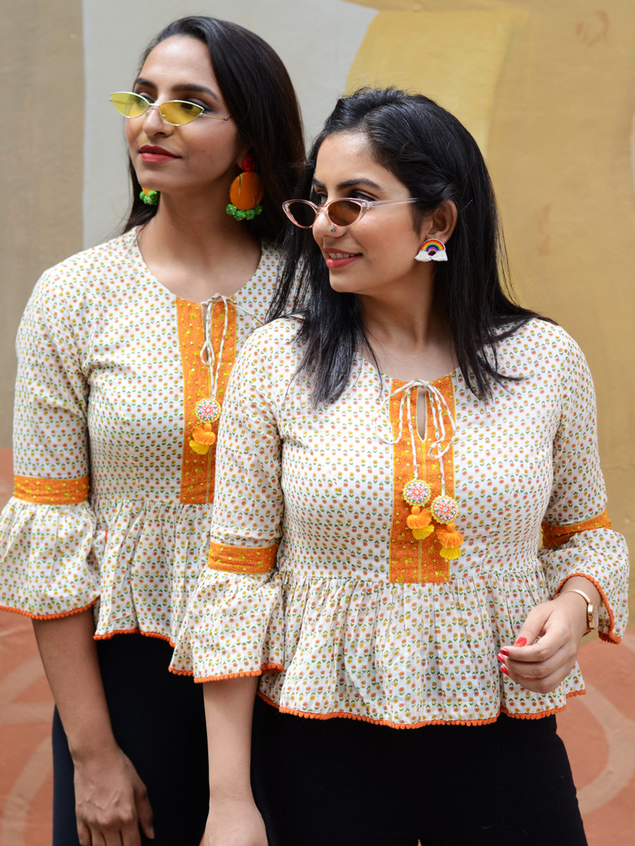 Nysa Bell Sleeves Top, quirky boho bell sleeves top with pom pom detail from our designer collection of tops for women.