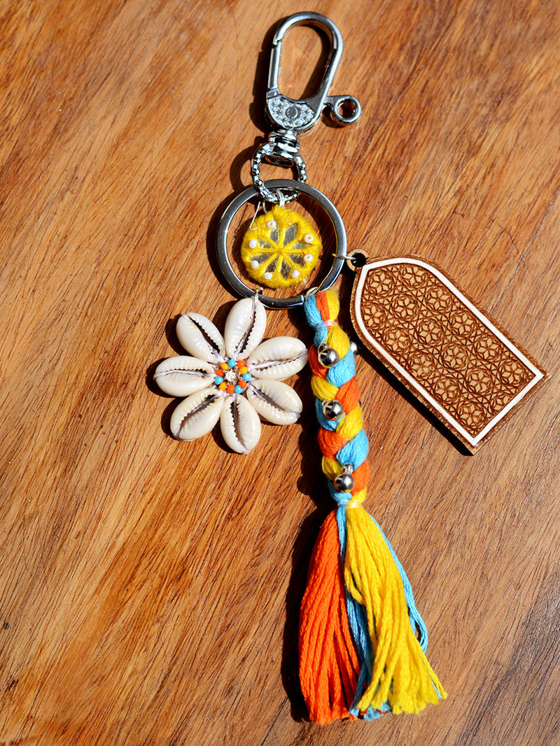 Boho Shell Keychain Bagcharm, a unique handcrafted keychain bag charm with shells, beads and mirror detailing from our designer collection of hand embroidered keychain and bag charms online.