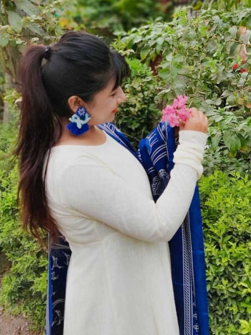 Nida Shine Earrings, a handcrafted unique coin earring with handmade ikat base and mirror and tassel detailing from our bohemian collection of earrings for women.