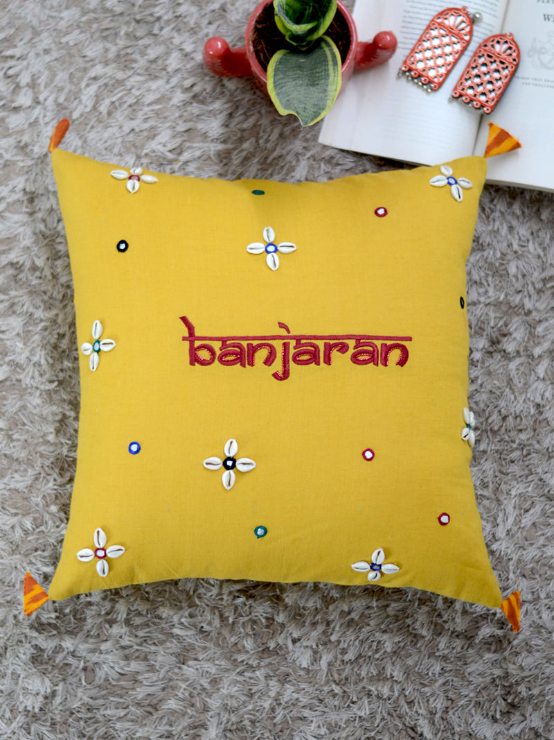 Banjaran Cushion Cover, a hand embroidered cotton cushion cover with shell, mirror and tassel detailing from our wide range of bohemian home decor products like ethnic cushion covers, thread art and more.