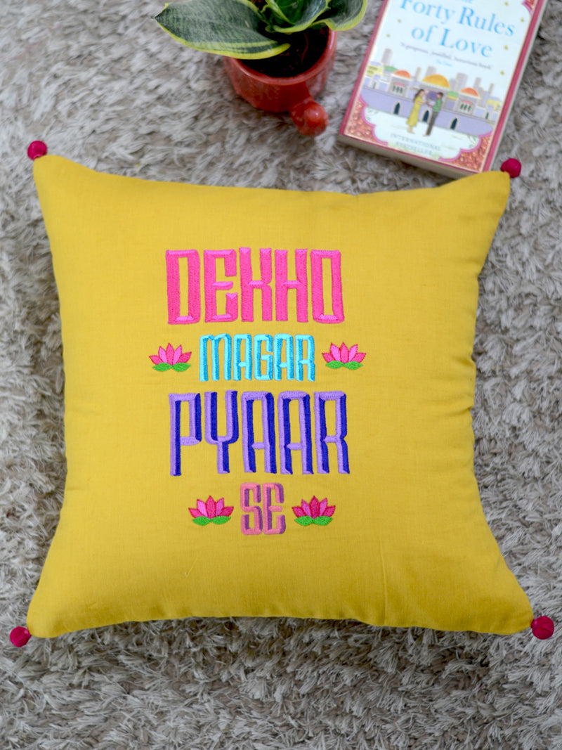 Dekho Magar Pyaar Se Cushion Cover, a hand embroidered cotton cushion cover with pom pom detailing from our wide range of bohemian home decor products like ethnic cushion covers, thread art and more.