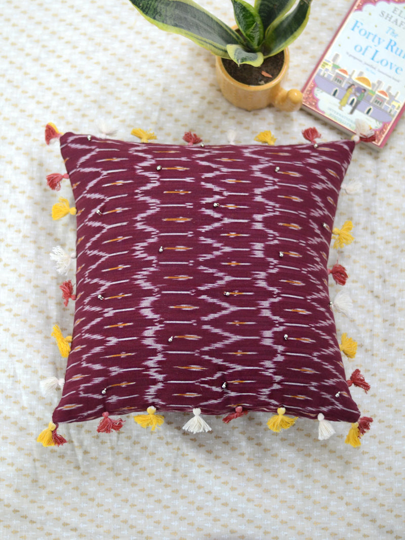 Prosperity Cushion Cover (Maroon), a hand embroidered cotton cushion cover with soundless ghungroo and tassel detailing from our wide range of bohemian home decor products like ethnic cushion covers, thread art and more.