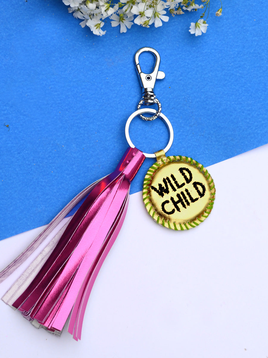 Wild Child Keychain Bagcharm, a unique handcrafted keychain bag charm with tassel detailing from our designer collection of hand embroidered keychain and bag charms online.